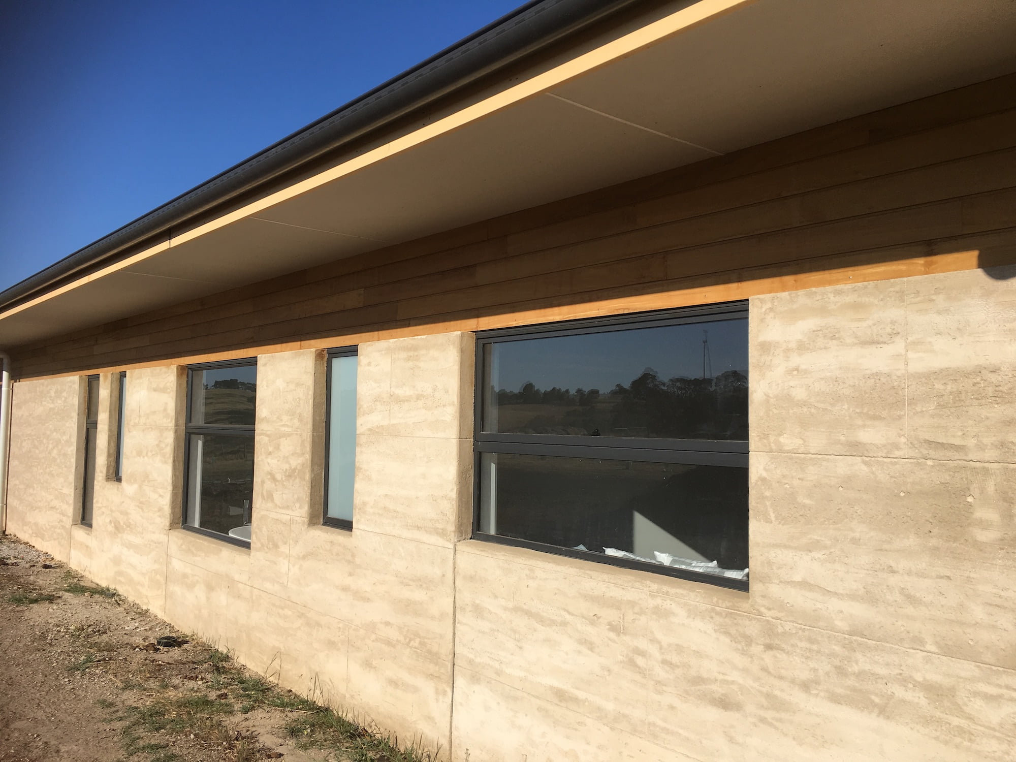 Romano-Carved-Stone-rammed-earth-home-torquay-